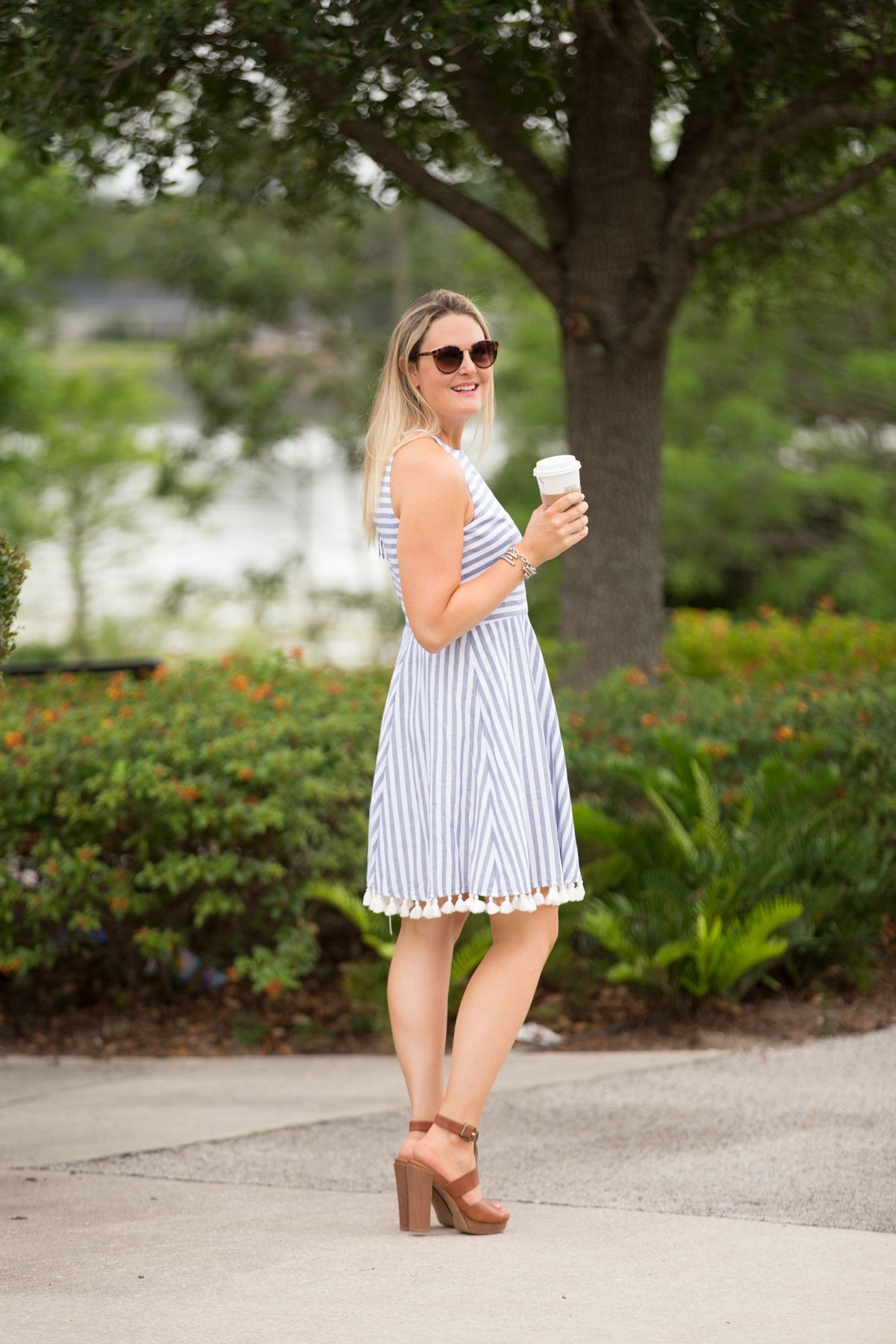 Florida lifestyle blogger, MikaelaJ, shares a beautiful dress lined with tassels. Check out this unique dress now!