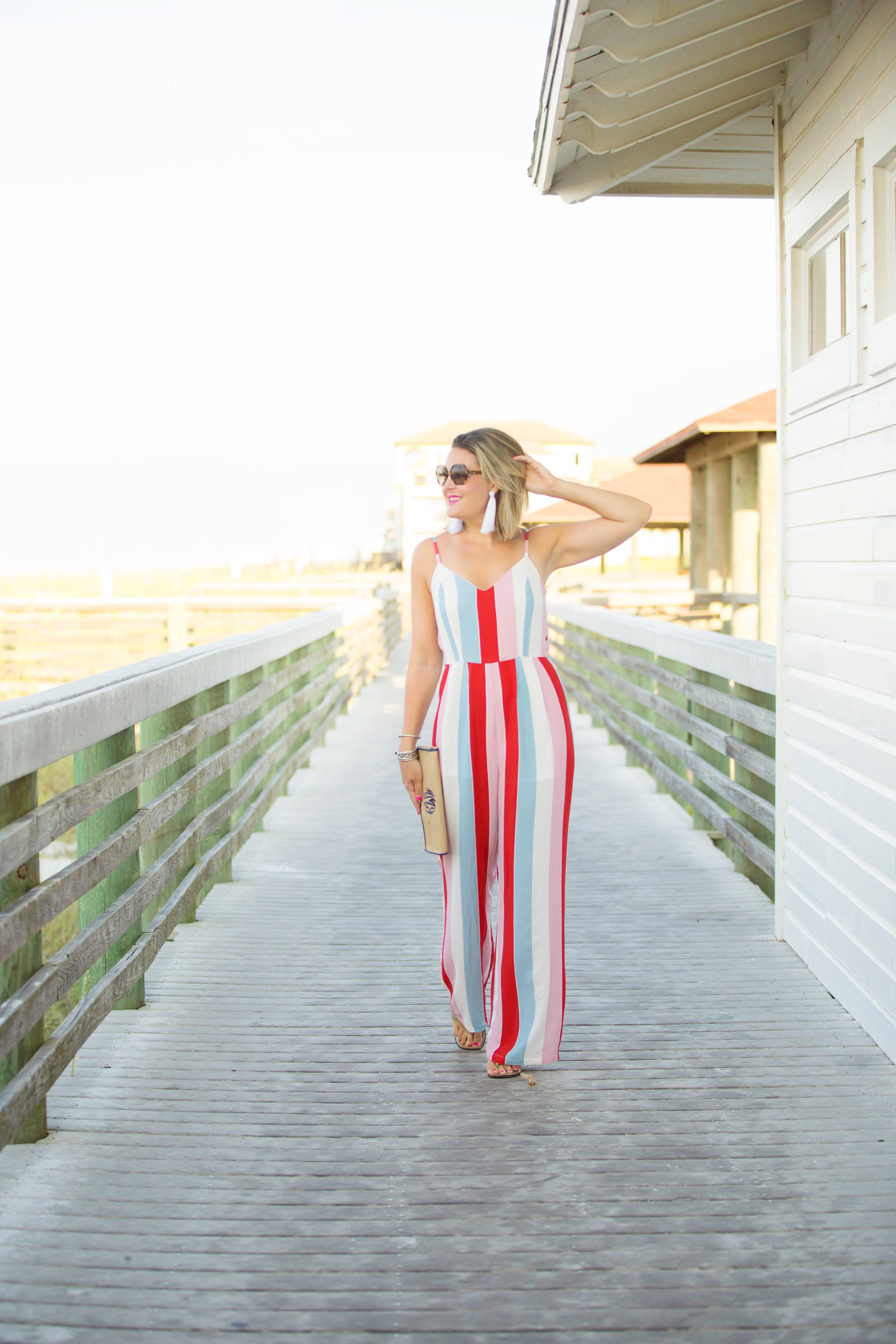 Florida lifestyle blogger, MikaelaJ, shares a striped jumpsuit! It's perfect for Summer with its bright and colorful stripes! 