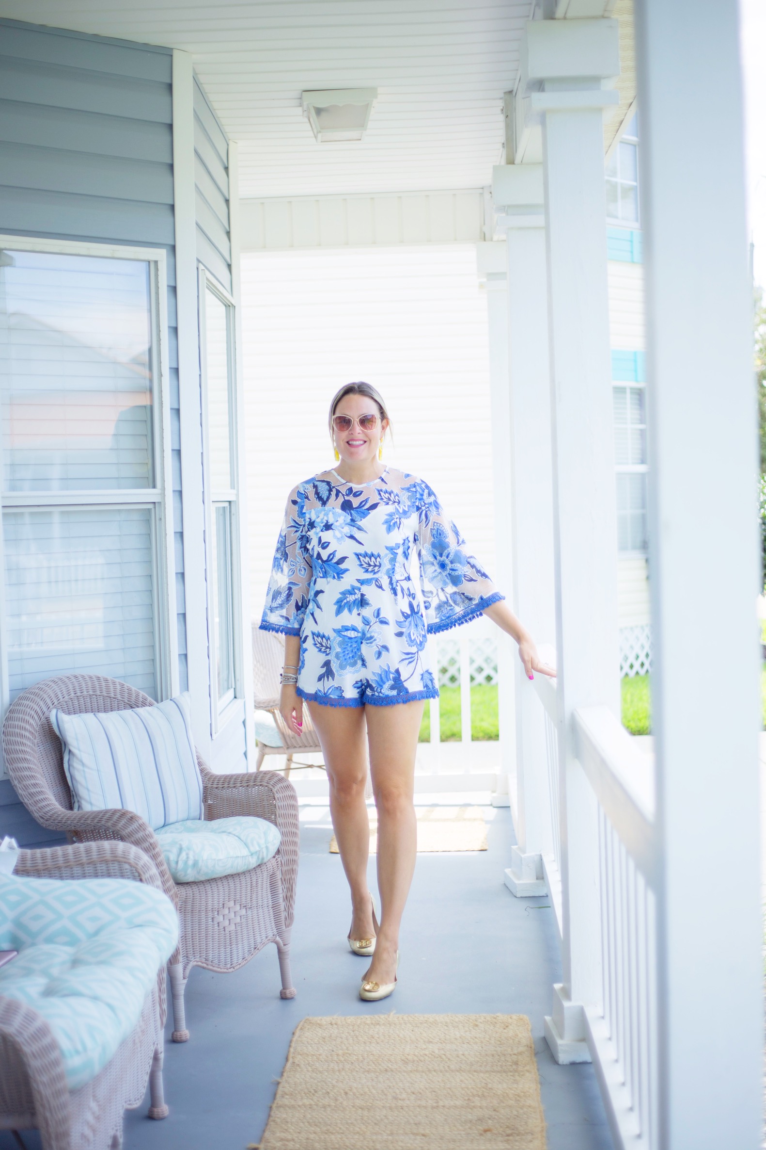 Florida lifestyle blogger, MikaelaJ, shares a beautiful blue and white summer floral romper in this weeks edition of What I'm Wearing Wednesday!